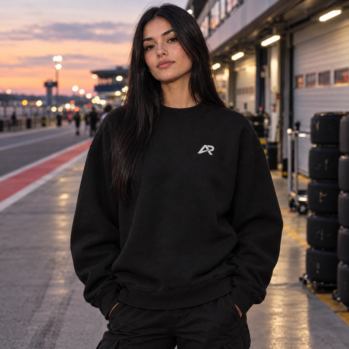 Woman wearing the Allison Racing embroidered logo sweatshirt in the paddock